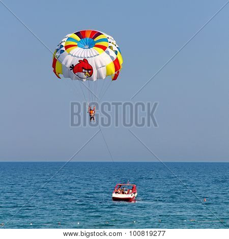 Parasailing In A Blue Sky.