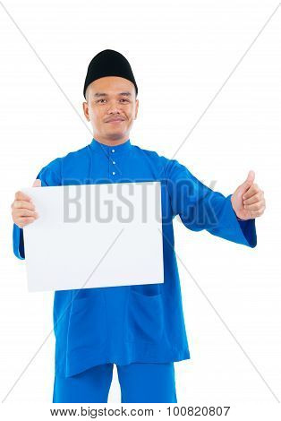 Muslim man holding a white board