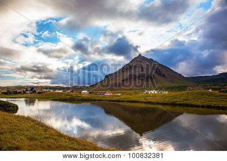 Sunset in the fishing village of Arnastapi. Evening in the Arctic