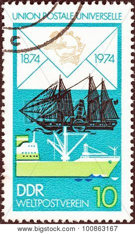 GERMAN DEMOCRATIC REPUBLIC - CIRCA 1974: Stamp shows James Watt (paddle steamer), Modern Freighter
