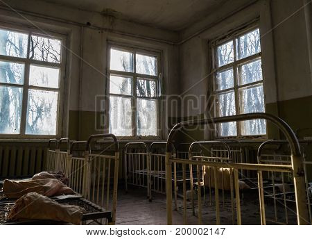 A desolate abandoned nursery after a terrible Chernobyl event