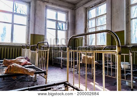 A desolate abandoned nursery after a terrible Chernobyl event