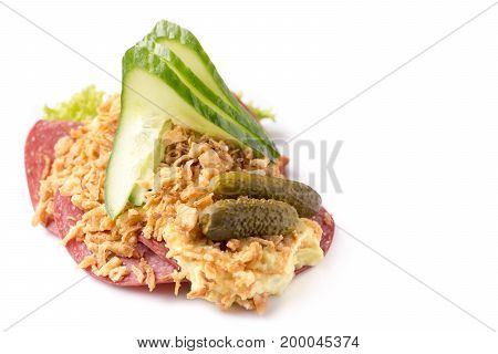 Danish specialties and national dishes high-quality open sandwich Salami with crispy fried onion remoulade and cucumber isolated on white background