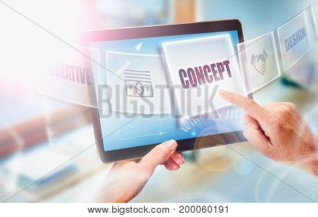 A Businesswoman Selecting A Business Concept On A Futuristic Portable Computer Screen.