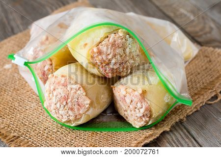 Frozen stuffed peppers in a plastic bag. Frozen food