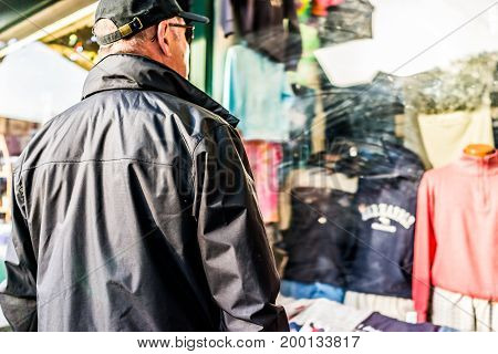 Bar Harbor USA - June 8 2017: Sidewalk in Maine downtown village in summer by stores and people window shopping