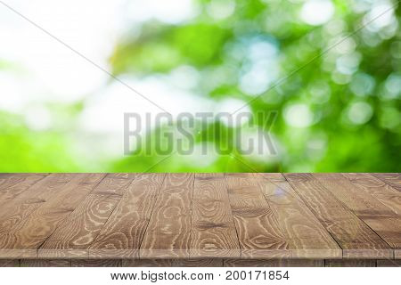Empty wooden table for product placement or montage with focus to table top in the foreground, with white background. Wooden board empty table perspective.