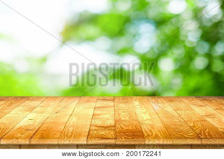 Empty wooden table for product placement or montage with focus to table top in the foreground, with white background. Wooden board empty table perspective.