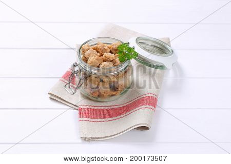 jar of soy meat cubes on place mat