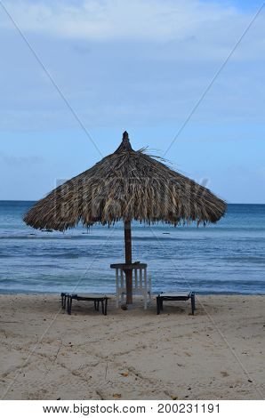 Tiki hut that is deserted on Eagle Beach.
