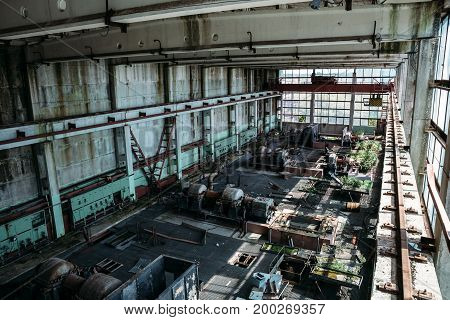 Large workshop in an abandoned factory, abandoned industrial concept, toned