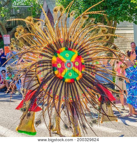 Provincetown Massachusetts US August 17 2017 People walking in the 39th Annual Provincetown Carnival Gods and Goddess Parade on Commercial Street
