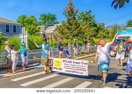 Provincetown Massachusetts US August 17 2017 People walking in the 39th Annual Provincetown Carnival Gods and Goddess Parade on Commercial Street