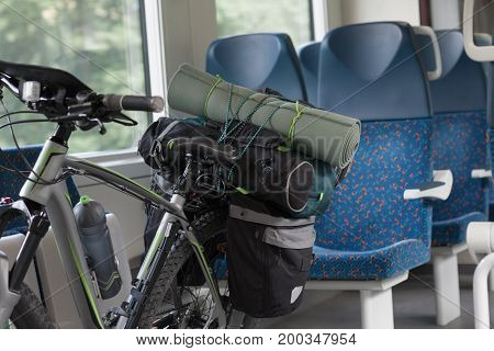 Mountain Bike With Saddlebags Is Transported In The Train.