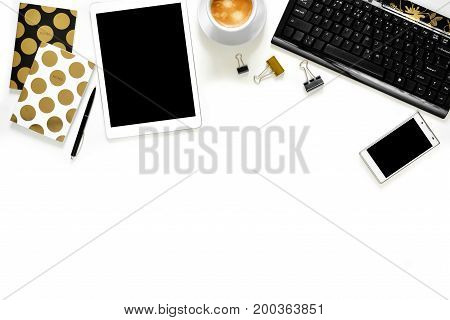 Flat Lay Photo Of Office White Desk With Tablet, Keyboard And Gold Notebook Copy Space Background