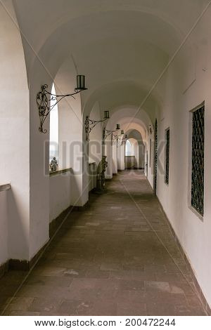 MUKACHEVO, UKRAINE - AUGUST 20б 2017: Buildings Palanok Castle in the rainy summer.
Standing on the town hill, the medieval Palanok Castle with its peaked turrets is the key sight of the ancient Mukachevo.