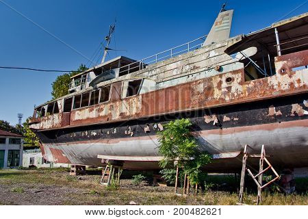 Rusty abandoned ship on the beach in Sukhum, Abkhazia, Georgia