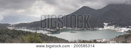 Lake in the mountains in winter on a foggy day (Greece, mountainous Corinthia)