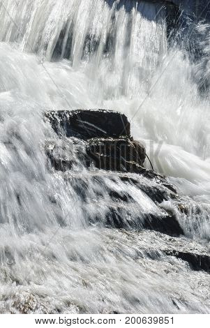 Rocky steps under turbulent Barden Reservoir waterfall