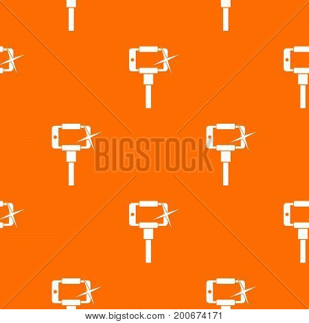 Taking pictures on smartphone on selfie stick pattern repeat seamless in orange color for any design. Vector geometric illustration