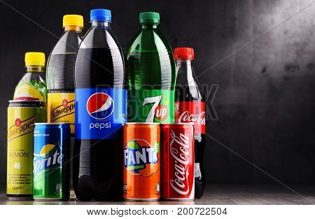 Bottles And Cans Of Assorted Global Soft Drinks
