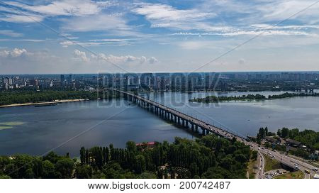 Aerial top view of Paton bridge and Dnieper river from above, city of Kiev, Ukraine