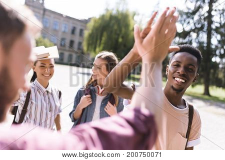 Students Giving Highfive