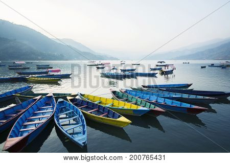 Boats at Phewa Lake in the evening Pokhara Nepal