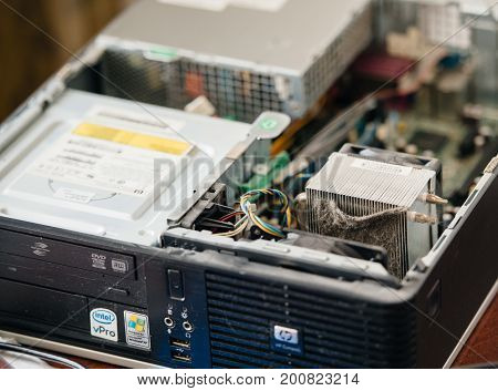 MOSCOW RUSSIA - AUG 7 2017: Massive dust particles covering the HP-Compaq personal computer heatsink preparing to repair and clean the computer for better operation