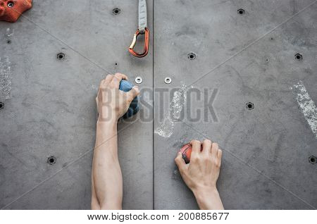 Close-up of asian male Climbing focus on hands