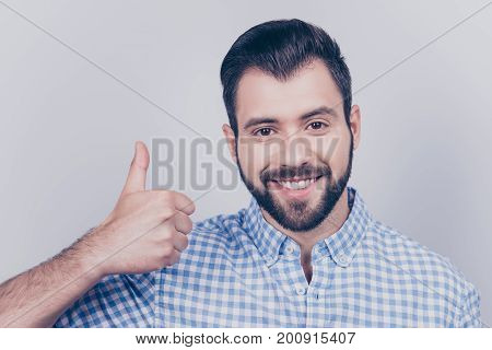 Close Up Cropped Portrait Of A Young Stylish Bearded Man In Formal Wear, Showing Thumbup Sign, Smili