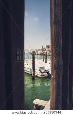 Murano view through two palisades Venice Italy to connote an architectural concept and tourist attraction