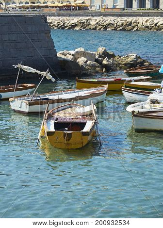 Fishing boats moored in Borgo Marinari harbor of Megaride island. Naples. Campania Italy.