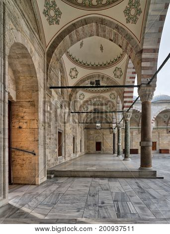 Passage leading to Fatih Mosque a public Ottoman Baroque style mosque with columns arches and marble floor Fatih district Istanbul Turkey