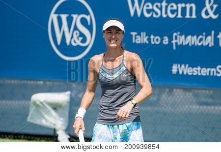 Mason Ohio - August 17 2017: Martina Hingis and Yung-Jan Chan play in a doubles match at the Western and Southern Open tennis tournament in Mason Ohio on August 17 2017.