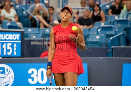 Mason Ohio - August 14 2017: Madison Keys in a first round match at the Western and Southern Open tennis tournament in Mason Ohio on August 14 2017.