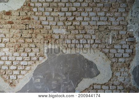 A well-detailed shot of a brick wall with some texture to use as a background image or a texture for 3D rendering.