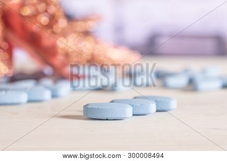 Group Of Three Whole Blue Medical Drug On The Table In A Hospital