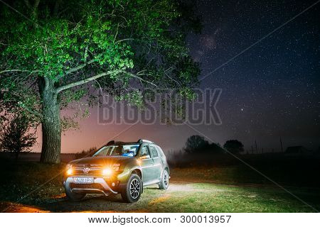 Gomel, Belarus - May 1, 2019: Night Starry Sky Above Car Renault Duster. Suv Parked Near Lonely Tree