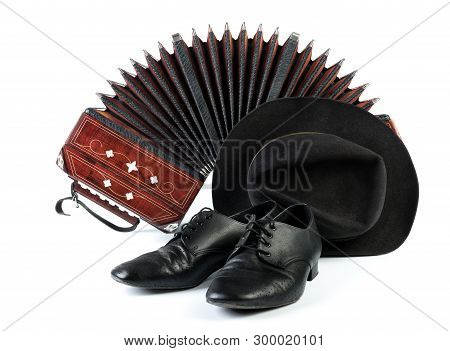 Bandoneon, Pair Of Tango Shoes And A Black Hat On White  Background