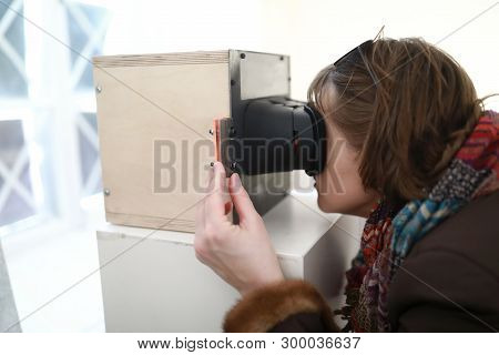 Woman Watching Slides In Stereoscope In Laboratory