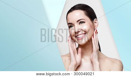 Beautiful Young Woman With Perfect Glow Smooth Clean Skin Touching Her Face. Portrait Of Model With 