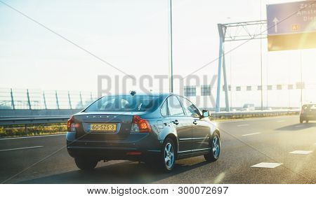 Netherlands - Aug 17, 2018: Gray Volvo V40 Car Driving Fast On Dutch Six Lane Highway