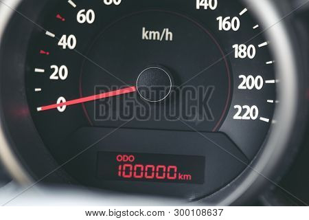 100k Mileage On Tachometer Of Car - Close Up View