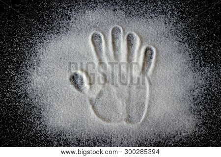 Handprint On The Scattered Sugar. Concept Is Healthy Eating, Diet, Control And Weight Loss