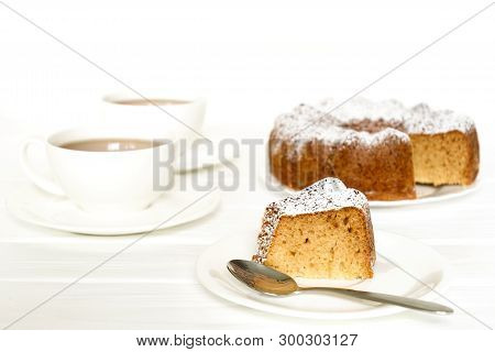 Morning Still Life With Bundt Cake And Tea On White Wooden Table. Selected Focus