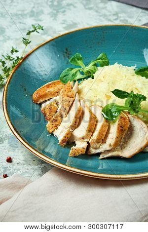 White Rice With Chicken Breast. Rizotto. Gray Light Textured Background. Beautiful Serving Of Dishes