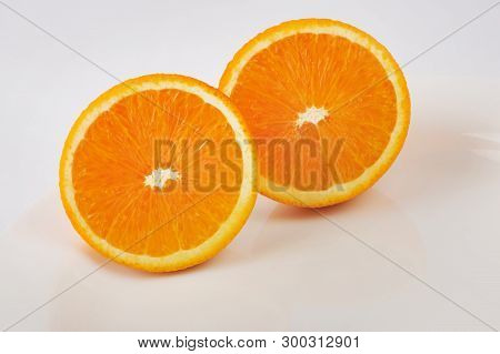 Fresh Slised Oranges Isolated On The Gray Background