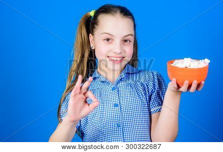 Delicious Marshmallow. Candy Shop. Small Girl Eat Delicious Marshmallow. Healthy Food And Dental Car
