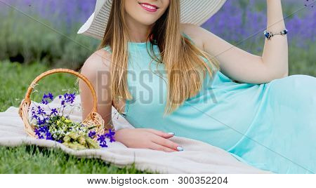 Girls In Dresses In Lavender 
Resting On A Grass